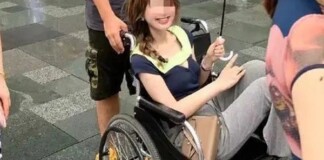 Ồn ào cảnh cô gái đi mua sắm bằng xe lăn chỉ để chân không dính mưa